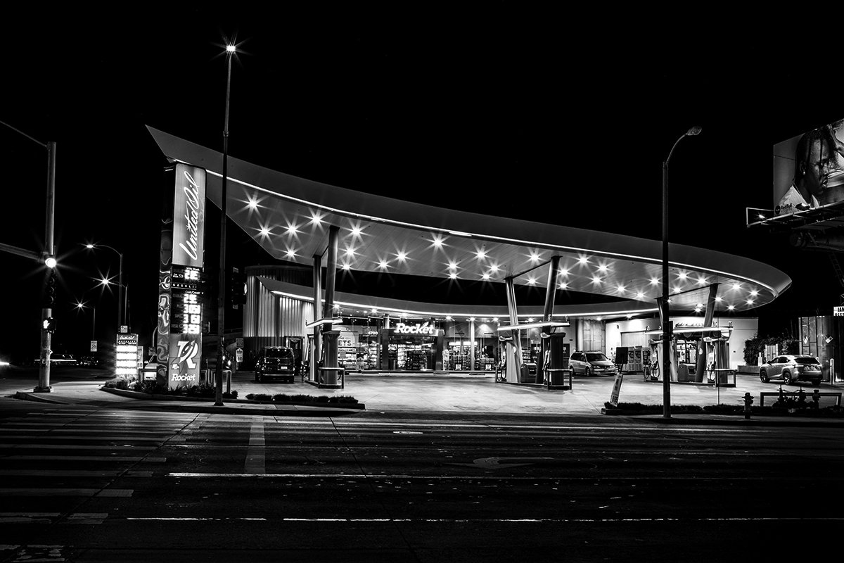 black and white photograph of a Los Angeles gas station at night